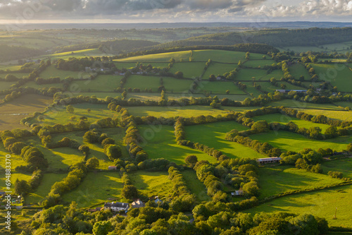 Aerial view by drone of rolling countryside in evening light, Devon, England, United Kingdom, Europe photo