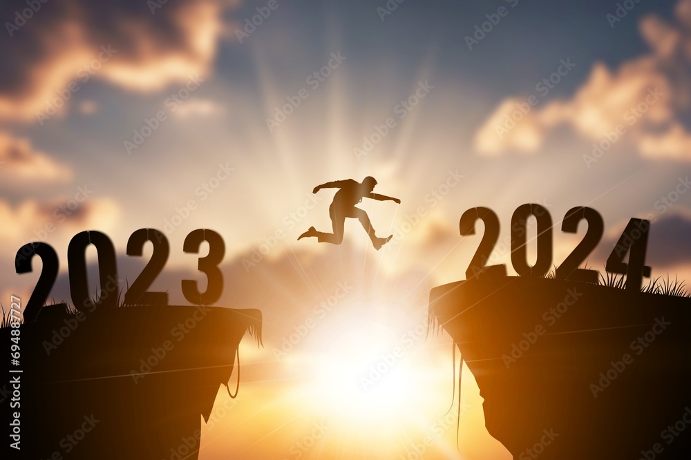 Welcome new year 2024, Silhouette jumping on cliff Welcome new year 2024, Silhouette jumping on cliff
