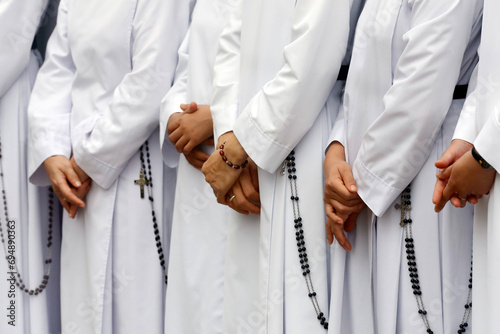 Close-up on hands and rosary, Dominican sisters, Bien Hoa, Vietnam, Indochina photo