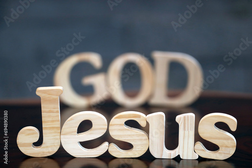 Wooden letters forming the words JESUS and GOD, Christian symbol, Vietnam, Indochina photo