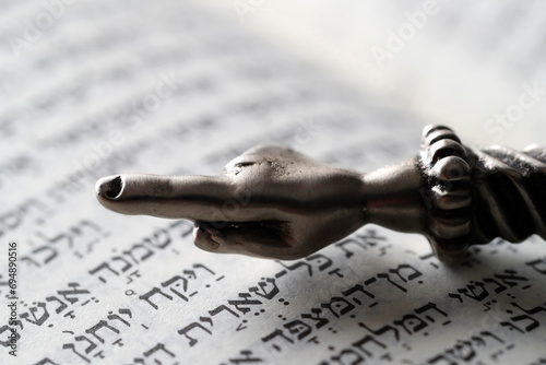 A silver Yad Jewish ritual pointer on a Torah, France photo