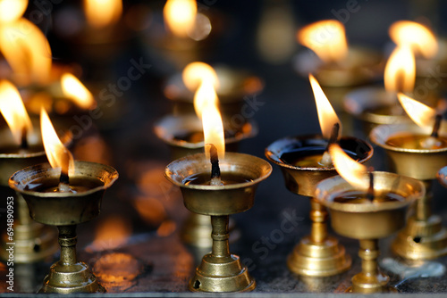 Oil (butter) lamps burning in Hindu temple, Kathmandu, Nepal photo