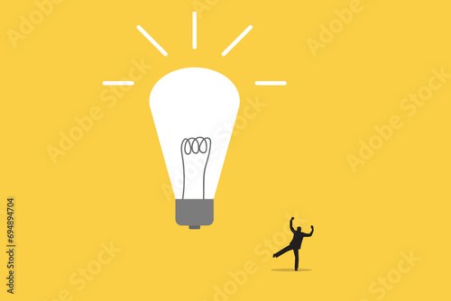 Businessman happy look lightbulb. Concept of New idea, brainstorming, innovation, success