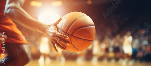 Close up shoot of professional basketball player bouncing the ball photo