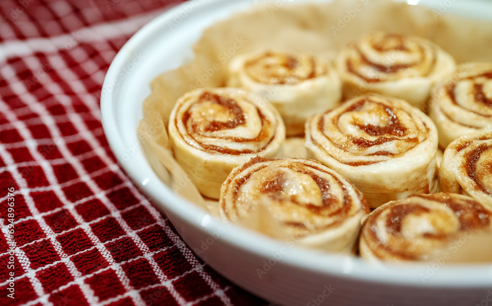 Fresh homemade raw Cinnamon rolls prepared for baking. Fresh homemade raw Cinnamon rolls prepared for baking.
