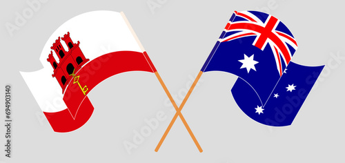 Crossed and waving flags of Gibraltar and Australia
