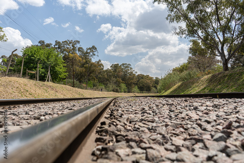 train tracks under a blue sky