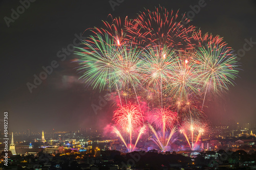 Beautiful fireworks and iconic Bangkok landmarks are illuminated during the Vijit Chao Phraya. (Lighten blending mode 2 layers)