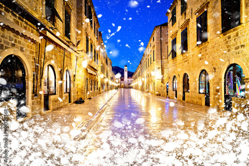 Famous Stradun street in Dubrovnik night winter snow view photo