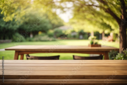 Wood table on blur of cafe, coffee shop, bar or restaurant background - can used for display or montage your products
