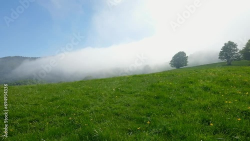 Fast moving clouds over a hill in the Parco dei Mille Laghi located in the Italian region of Emilia Romagna.
