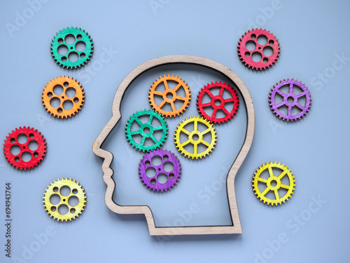 Autism and neurodiversity concept. Head and colored gears. photo