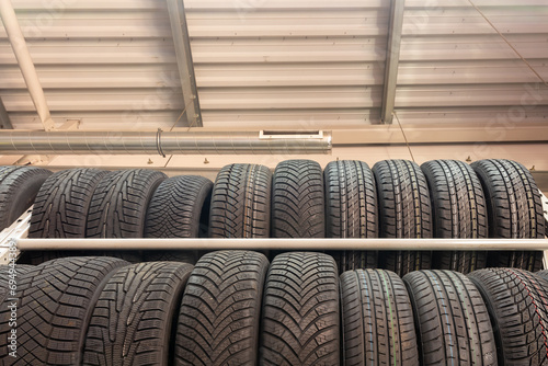 Car tires on rack in auto store.