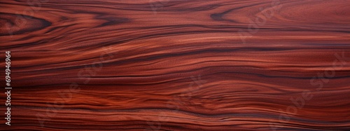 Amazon Rosewood Dalbergia spruceana wood texture and merterials background. Rare and expensive wood reddish-brown color with darker streaks texture background photo