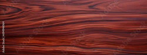 Amazon Rosewood Dalbergia spruceana wood texture and merterials background. Rare and expensive wood reddish-brown color with darker streaks texture background photo