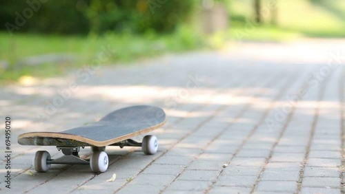 Empty skateboard drive along paving stone alley in the park photo