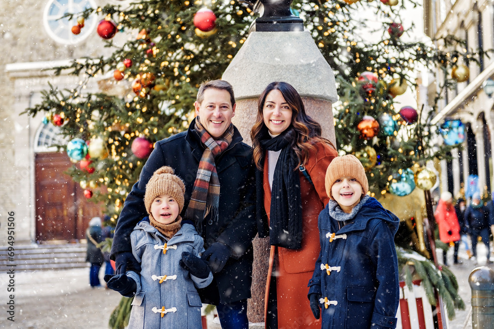 Fototapeta premium family with two little son having fun together outdoor on frosty day