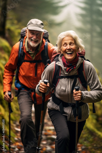 Happy old woman and men walking in the mountains in autumn