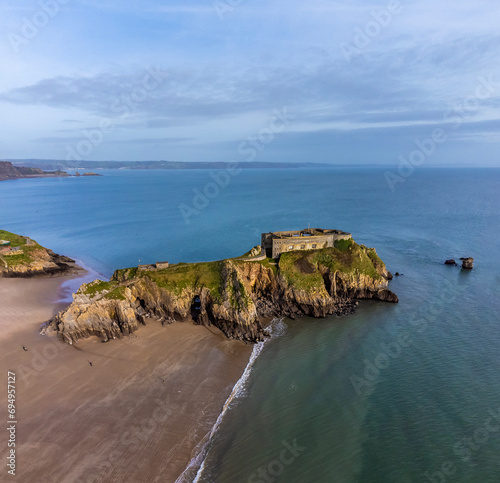 An aerial view towards Saint Catherines Island off the South beach in Tenby, Wales on a sunny day