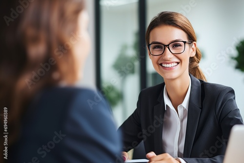 Step into the world of Human Resources as this captivating photo showcases a Human Resources Analyst conducting a job interview. With attentive listening and note-taking photo