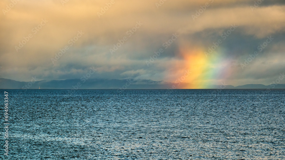 Firebow on the Moray Firth. The stack of colors is known as a circumhorizon (or circumhorizontal) arc—or, sometimes, a “firebow.”