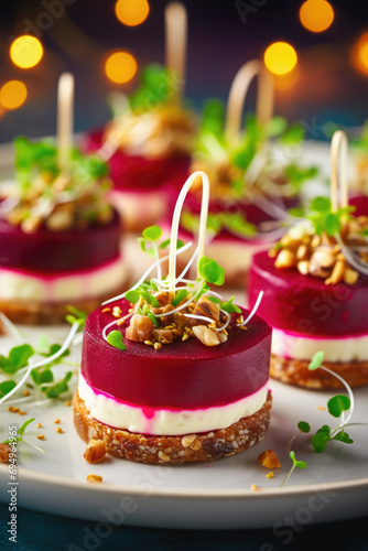 Festive appetizers from beetroot  cheese and multigrain bread on white plate.