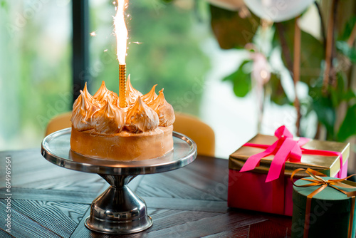 Photography close-up of delicious appetizing cake with lit candle during birthday celebratio