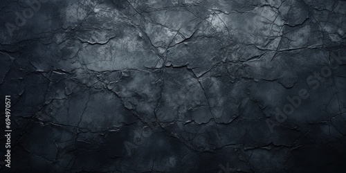 An old black wall with a rich, textured surface. photo