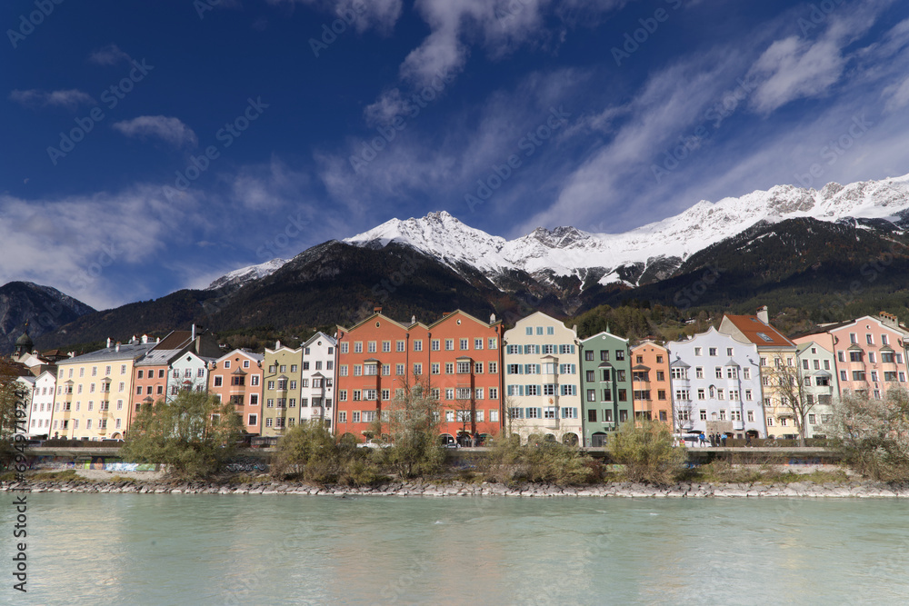 The characteristic colorful houses along the bank of the Inn River in Innsbruck
