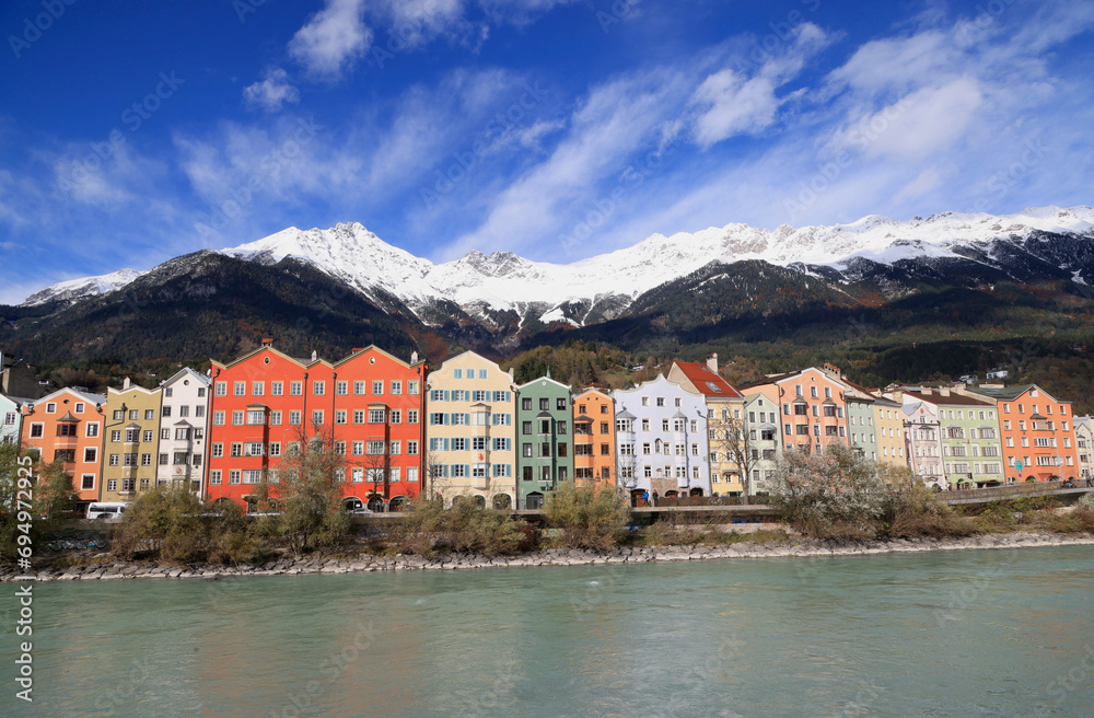 The characteristic colorful houses along the bank of the Inn River in Innsbruck