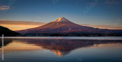 Landscape image of Mt. Fuji over Lake Kawaguchiko at sunrise in Fujikawaguchiko  Japan.