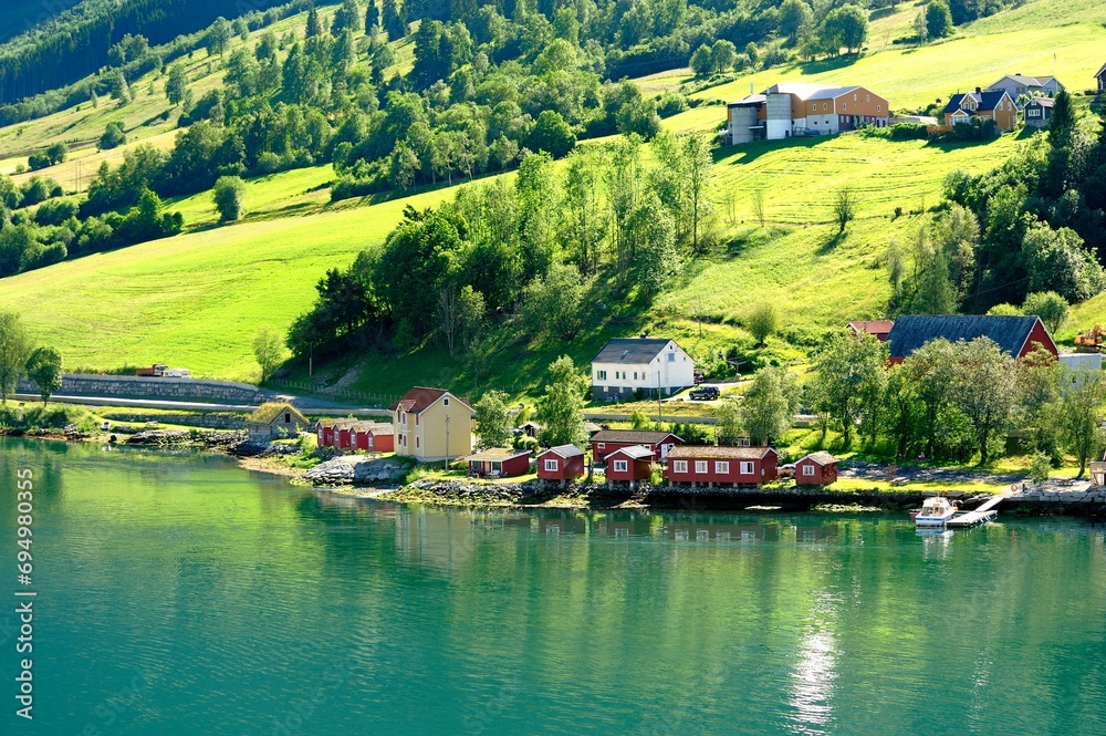 Naklejka premium Red traditional buildings on the water front