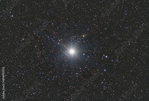 Capella, alpha Aurigae, the brightest star in the northern constellation of Auriga.  Star map night sky backgrounds photo