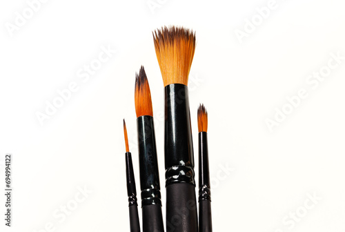 Four art brushes of different calibers in a vertical position. photo