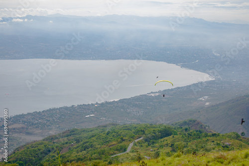 Paragliding soars at salena peak, palu city, Central sulawesi.