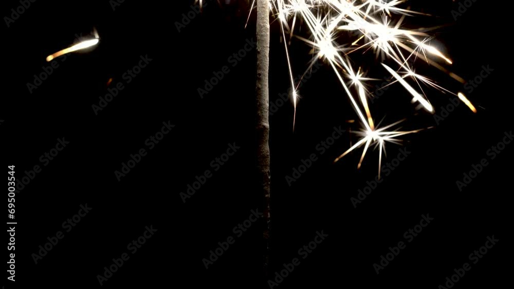 Bright sparklers on a black background, sparks, new year Bright sparklers on a black background, sparks, new year