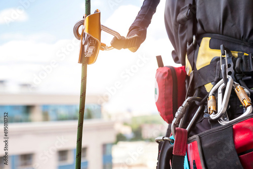 Equipment of industrial mountaineering worker on roof photo