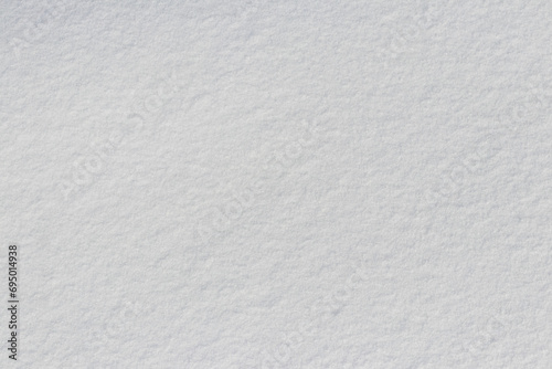 Snow texture. White surface of snow with clearly defined texture