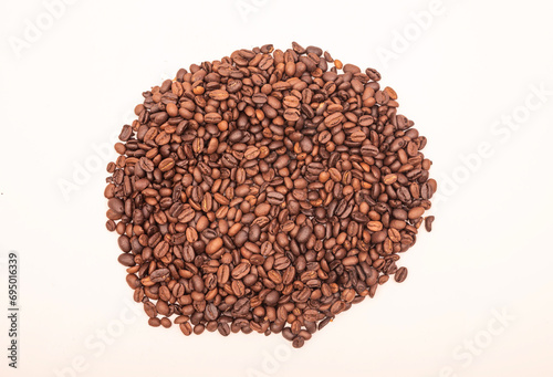 Pile of brown coffee beans isolated on white banner