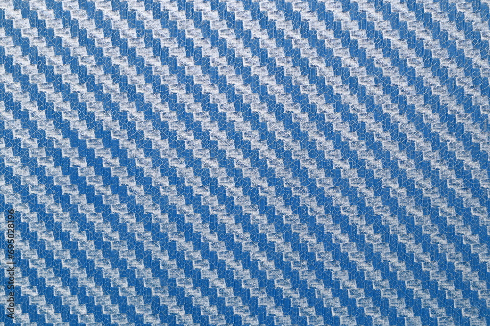 Blue Kevlar carbon fiber background, material kevlar carbon fiber composite. Blue Kevlar carbon fiber background, material kevlar carbon fiber composite.