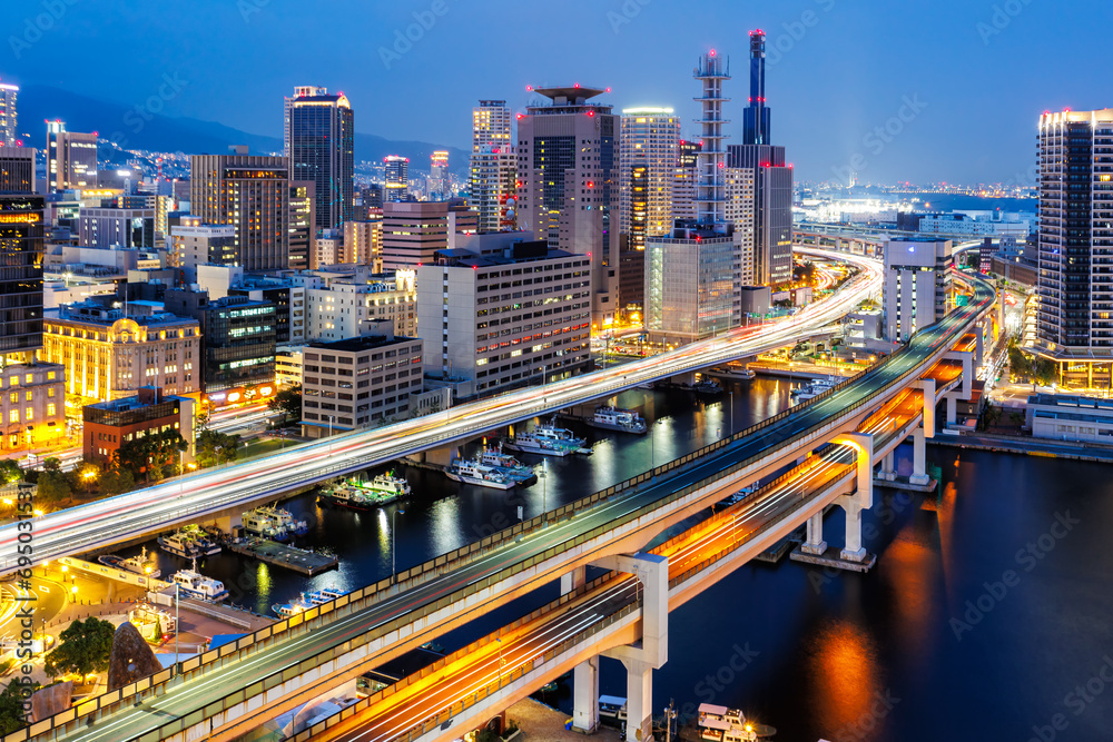 Kobe skyline from above with port and elevated road at twilight in Japan - obrazy, fototapety, plakaty 