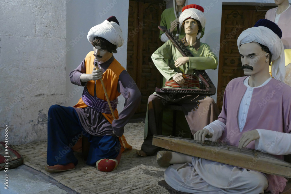 Diorama of mannequin musicians at a hospital