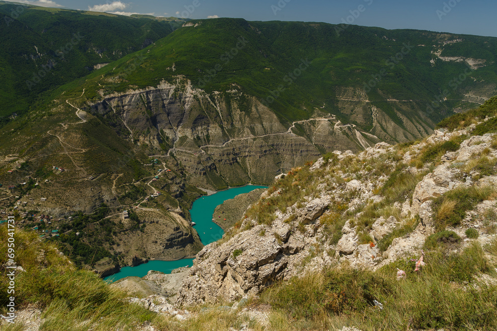 Deep canyon, view from the top of the winding river with azure water
