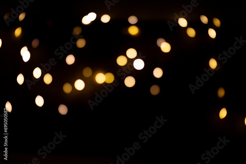 Bokeh golden lights on black background