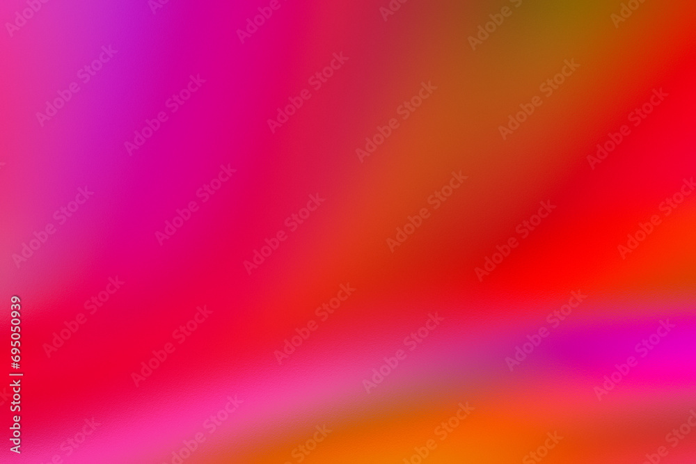 Color gradient blurred background with grainy and glass texture effect on red, pink and peach color.