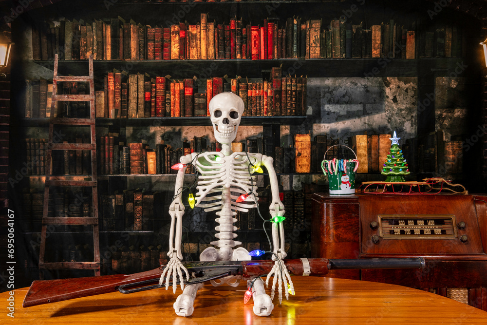 skeleton wrapped in Christmas lights holding retro bb gun with vintage radio and old library background - obrazy, fototapety, plakaty 