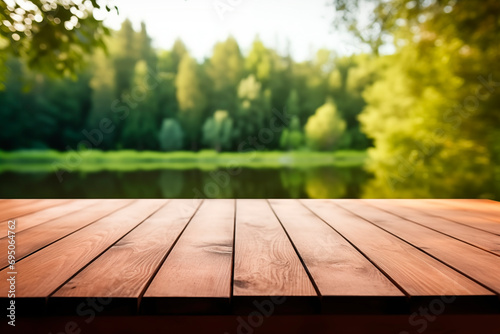 Wooden platform in the foreground, blurred lake and forest in the background, exuding peace.