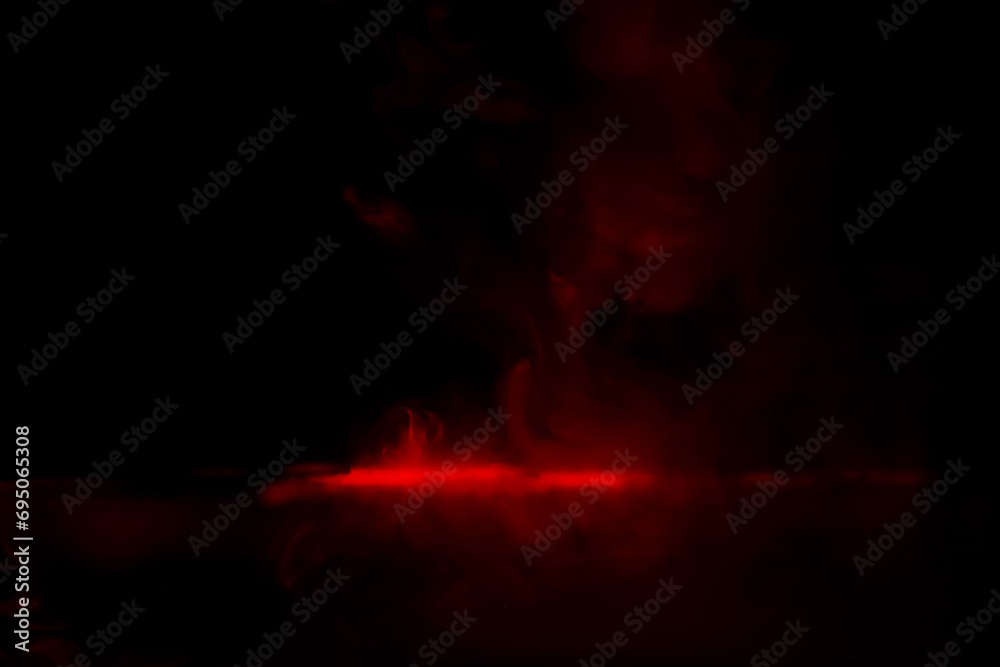 Red smoke over black studio background. Red steam on a black background. Copy space.