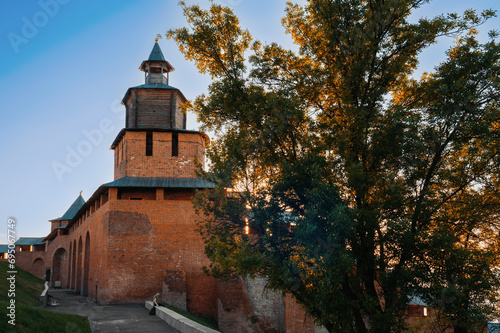 Fragment of the fortress wall of the Nizhny Novgorod Kremlin with the Clock Tower Nizhny Novgorod, Russia