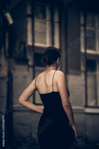 girl in a little black dress view from the back